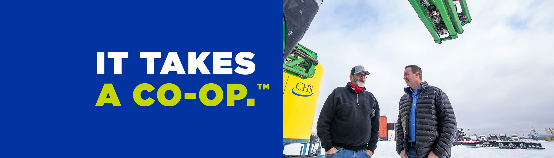 Two men on the left with IT TAKES A CO-OP on the left.