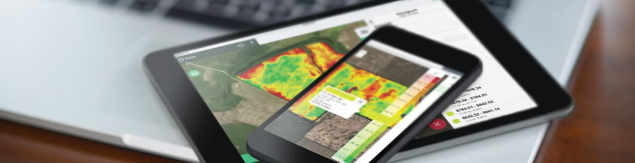 Tablet and smartphone showing precision ag software