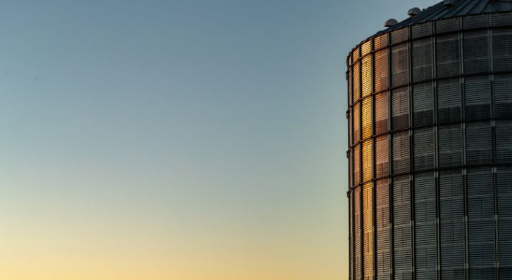 Grain bin at sunset
